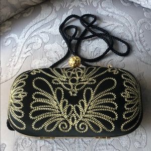 Black and gold cocktail purse. 6.5 in x 3 in.